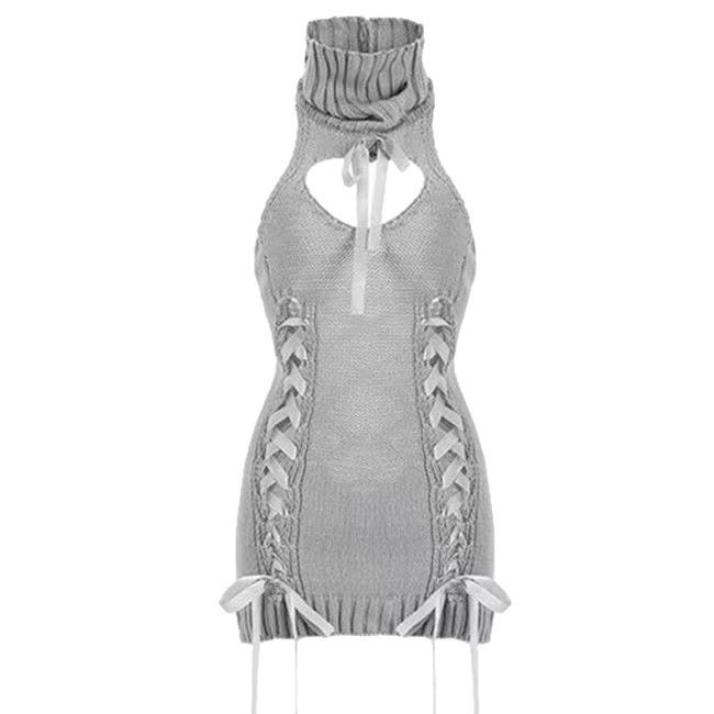 Sleeveless High-Neck Knit Sweater Dress with Hollow Strap Detail and White Stockings - Image 5